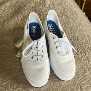 White canvas Keds.